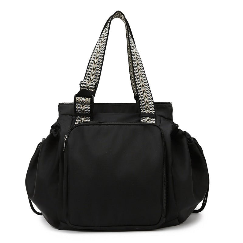 sac a langer fourre tout noir elegant et chic